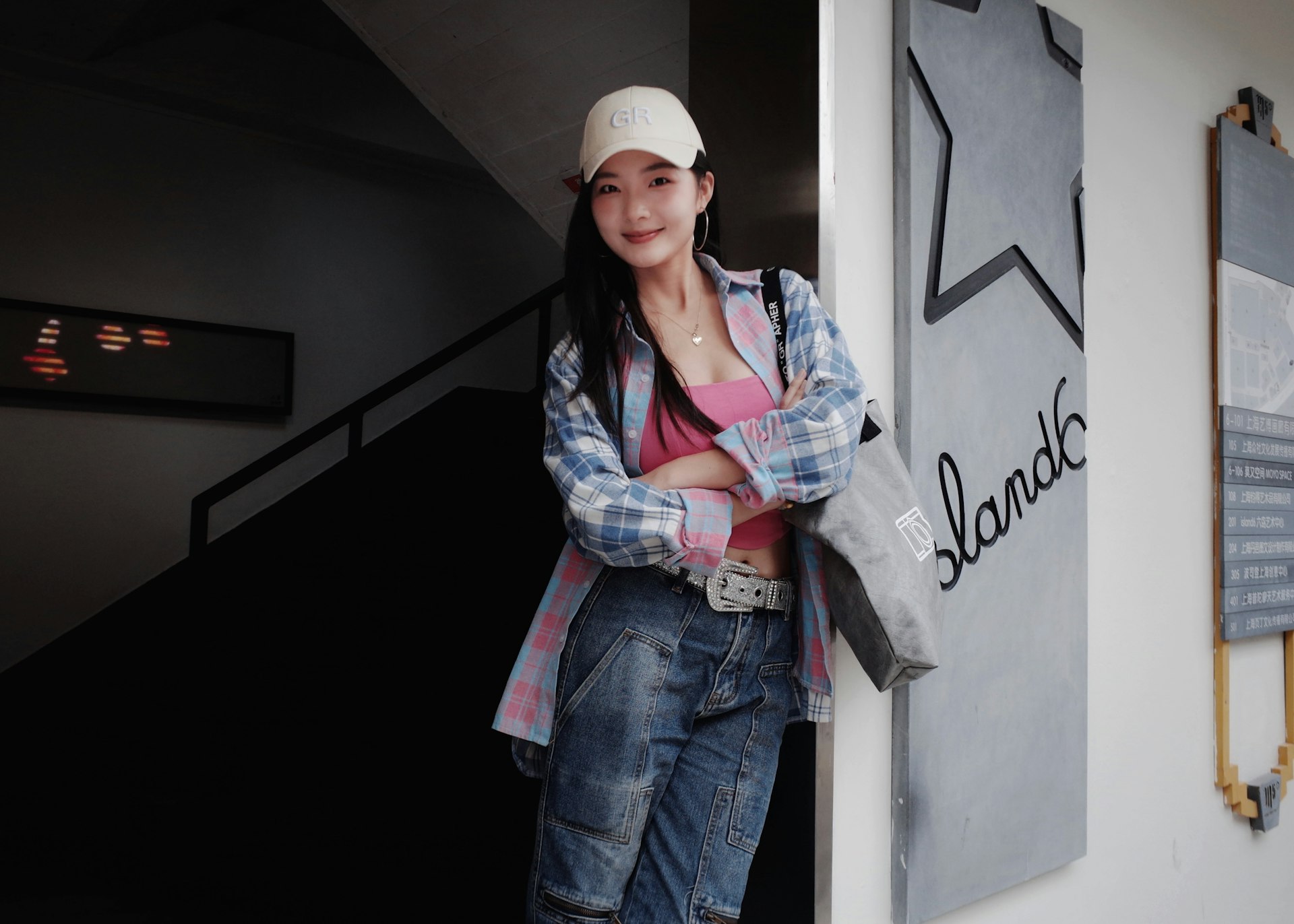 Young woman in casual clothes standing outdoors